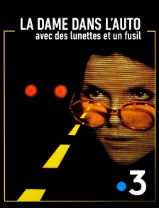 France 3 - La dame dans l'auto avec des lunettes et un fusil